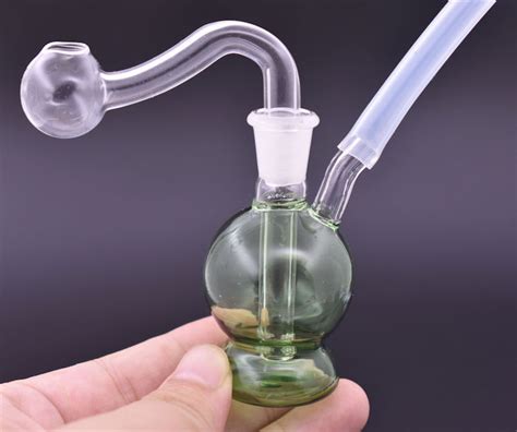 Suck on the pipe, and cover up the mouthpiece before sucking. . Oil burner bong stem